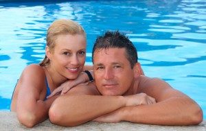 happy-couple-in-swimming-pool-300x191